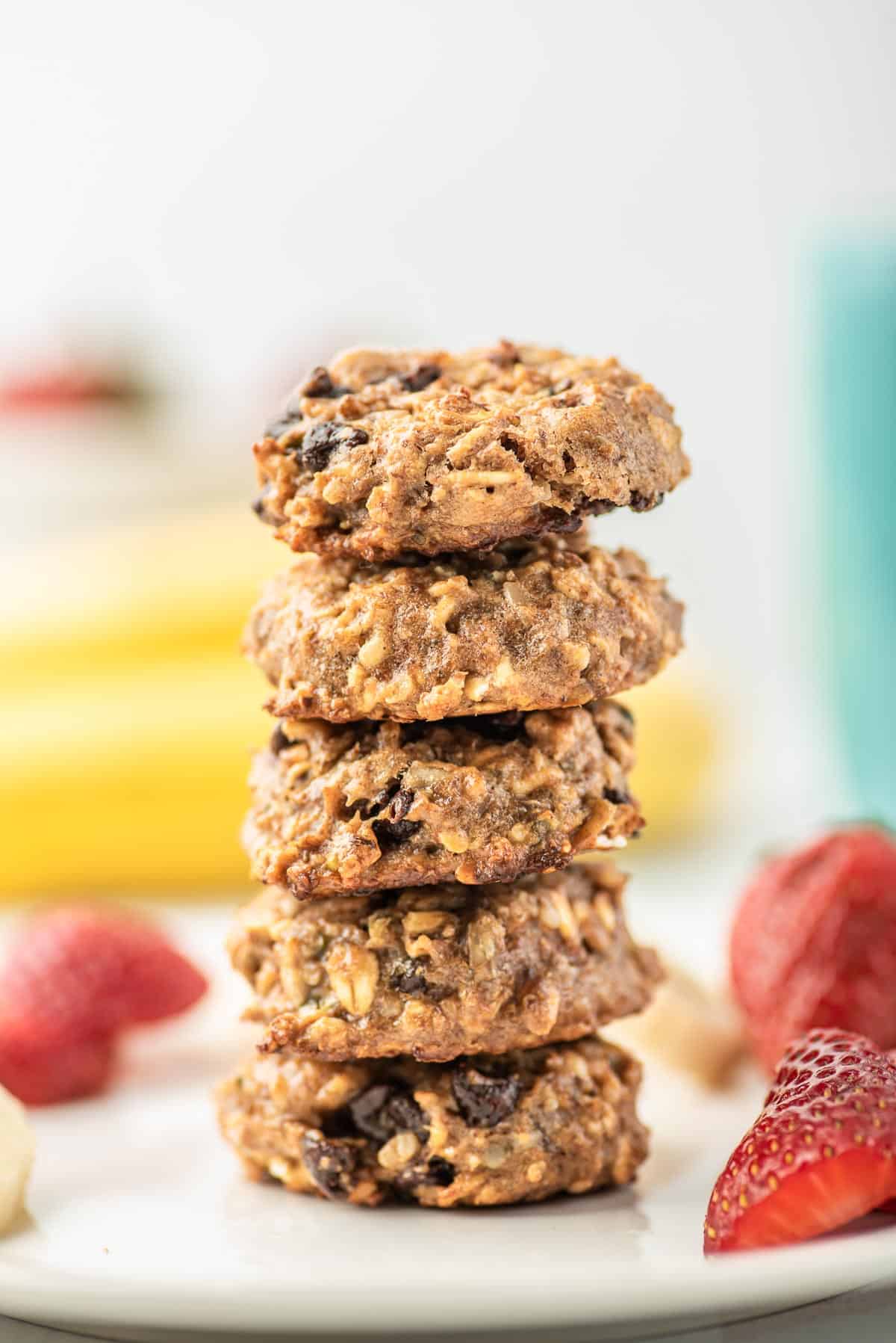 Stack of hearty cookies with oats, chocolate chips, sunflower seeds.