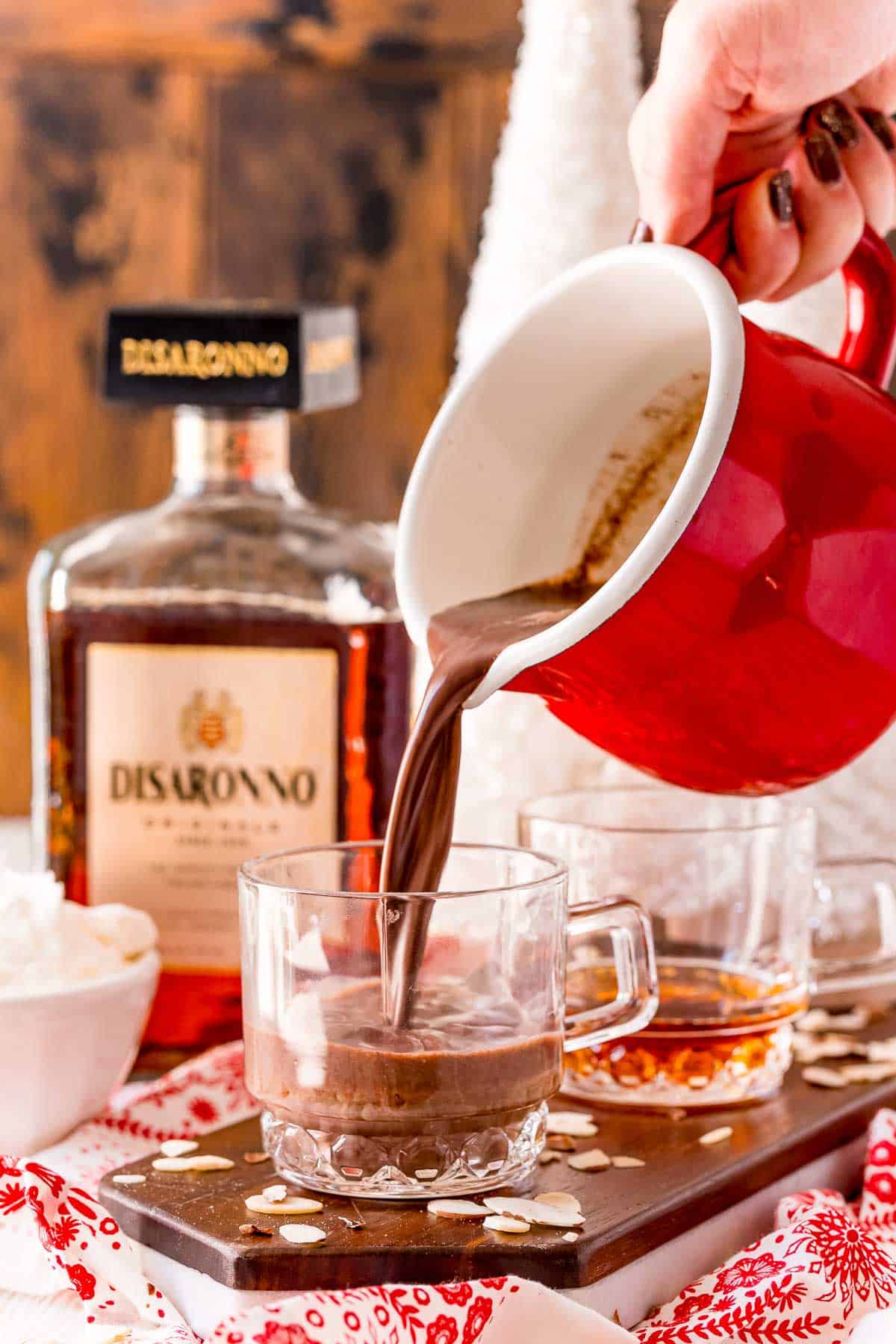 Hot cocoa being poured into a mug.