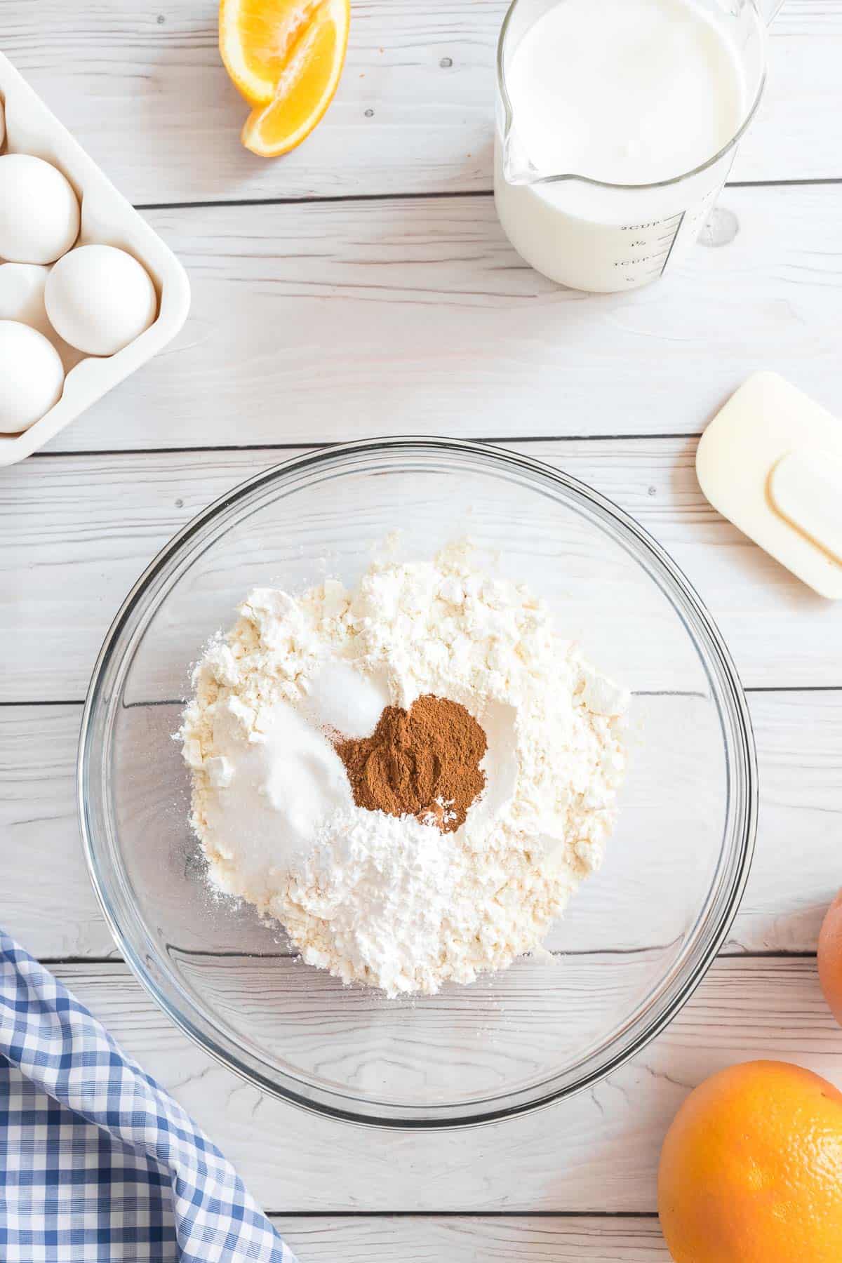 Pancake ingredients in a large glass mixing bowl.