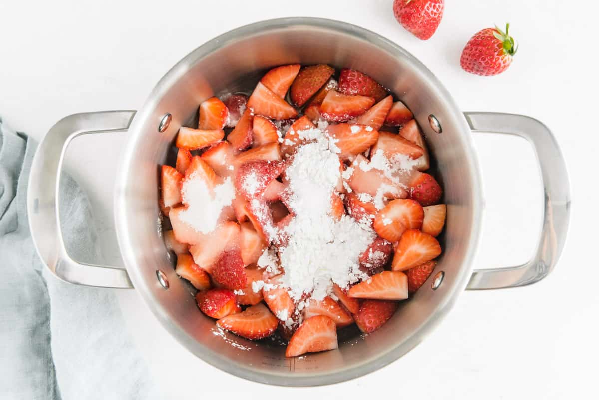 Berries, sugar, and cornstarch in a sauce pan.