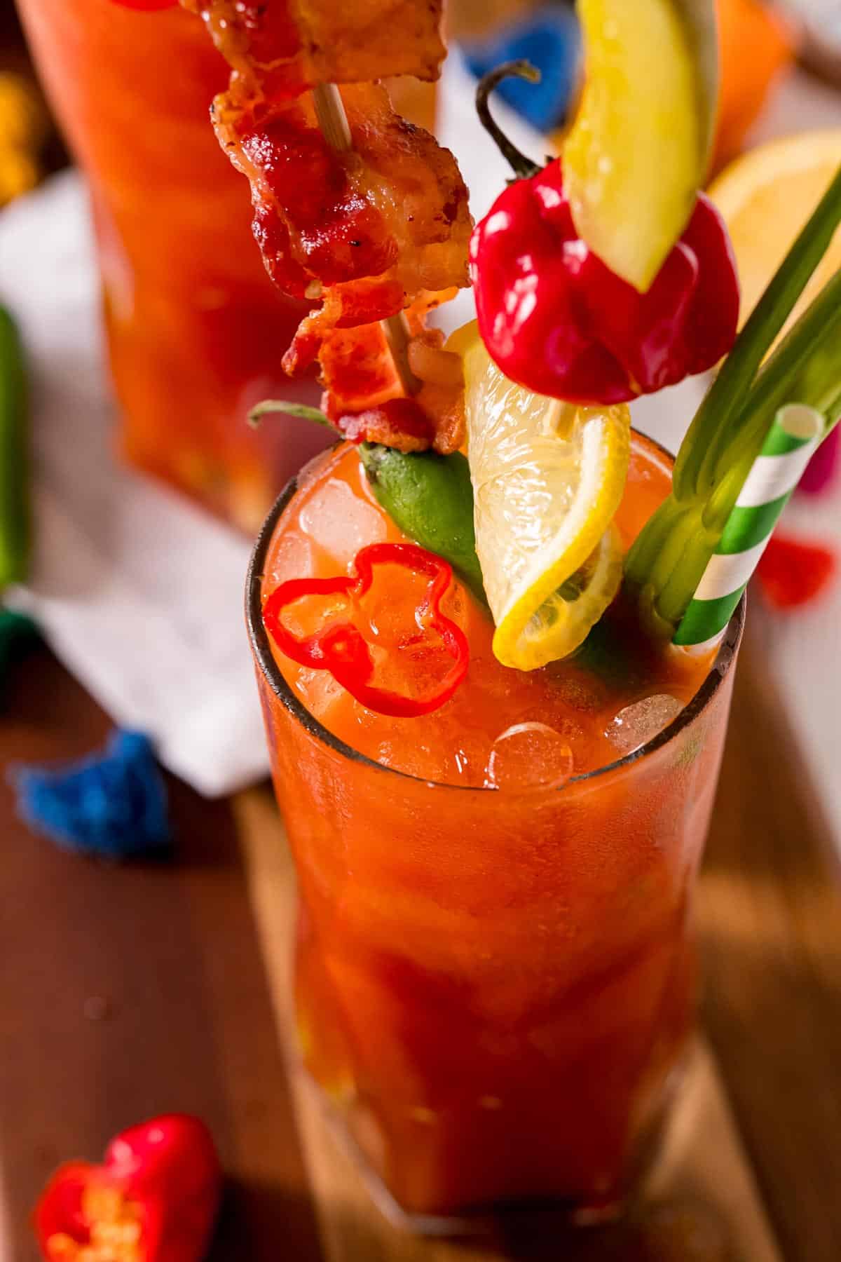 Close of cocktail showing colorful garnishes.