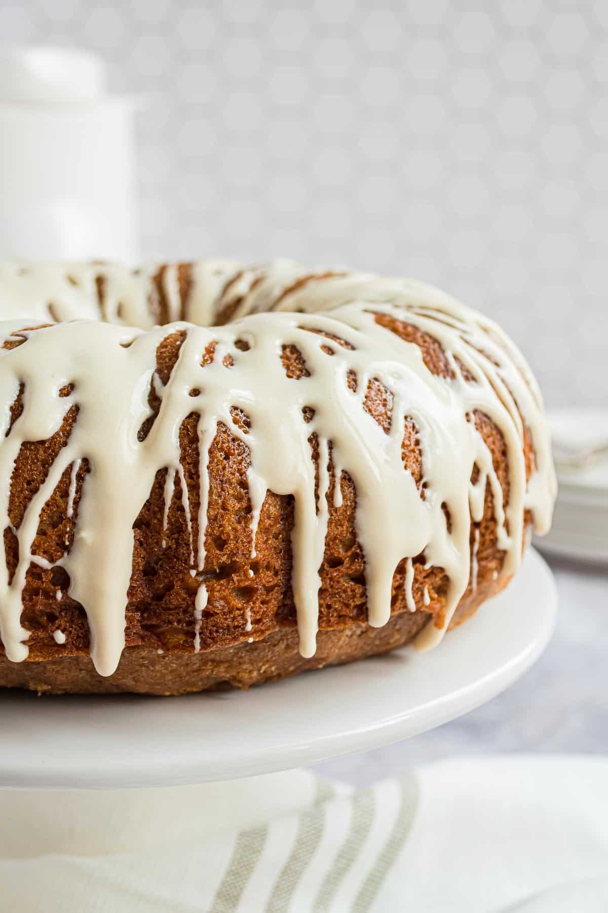 Maple cream cheese glaze on a bundt cake.