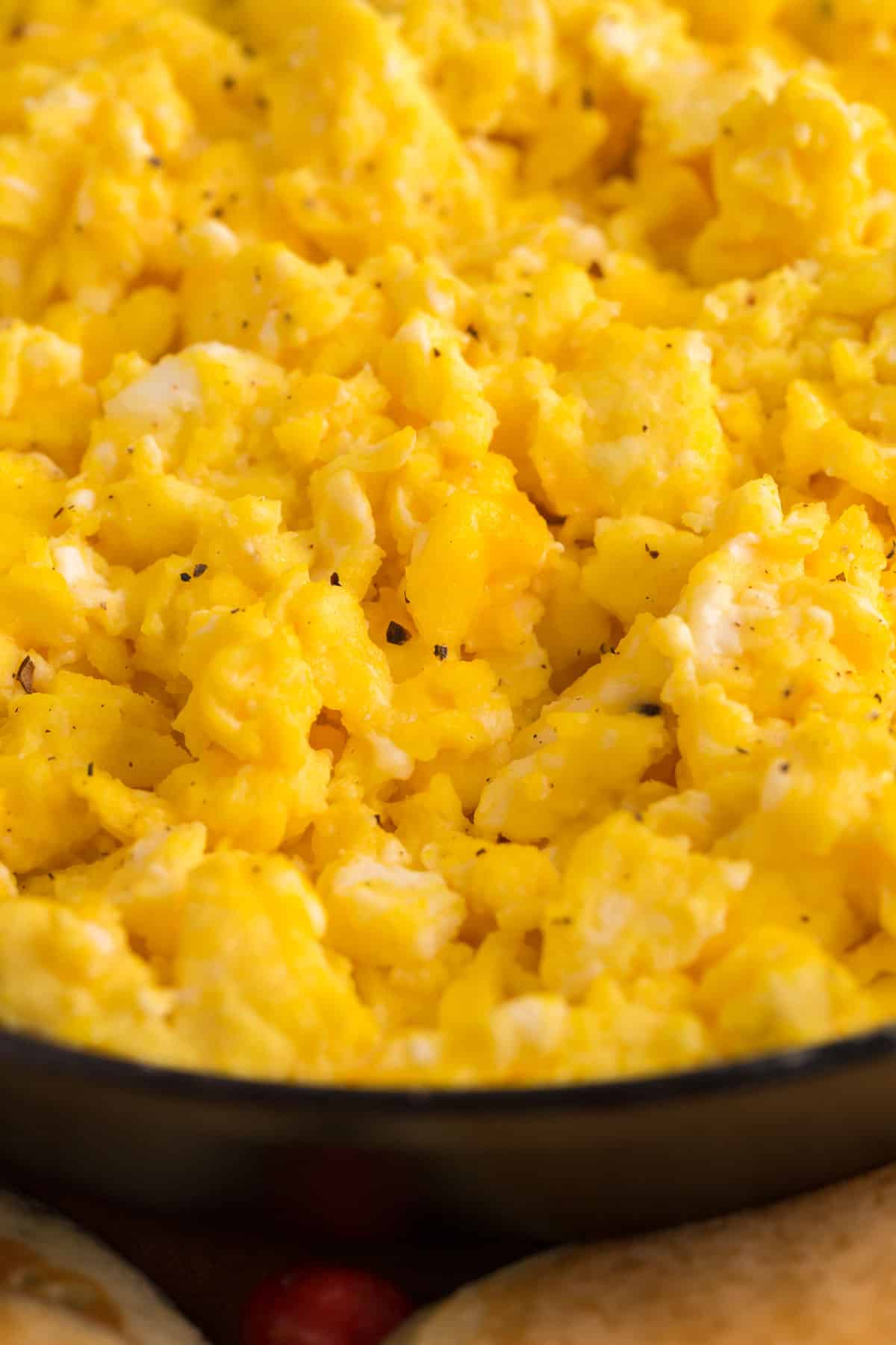 Close up view of scrambled eggs with cheese.