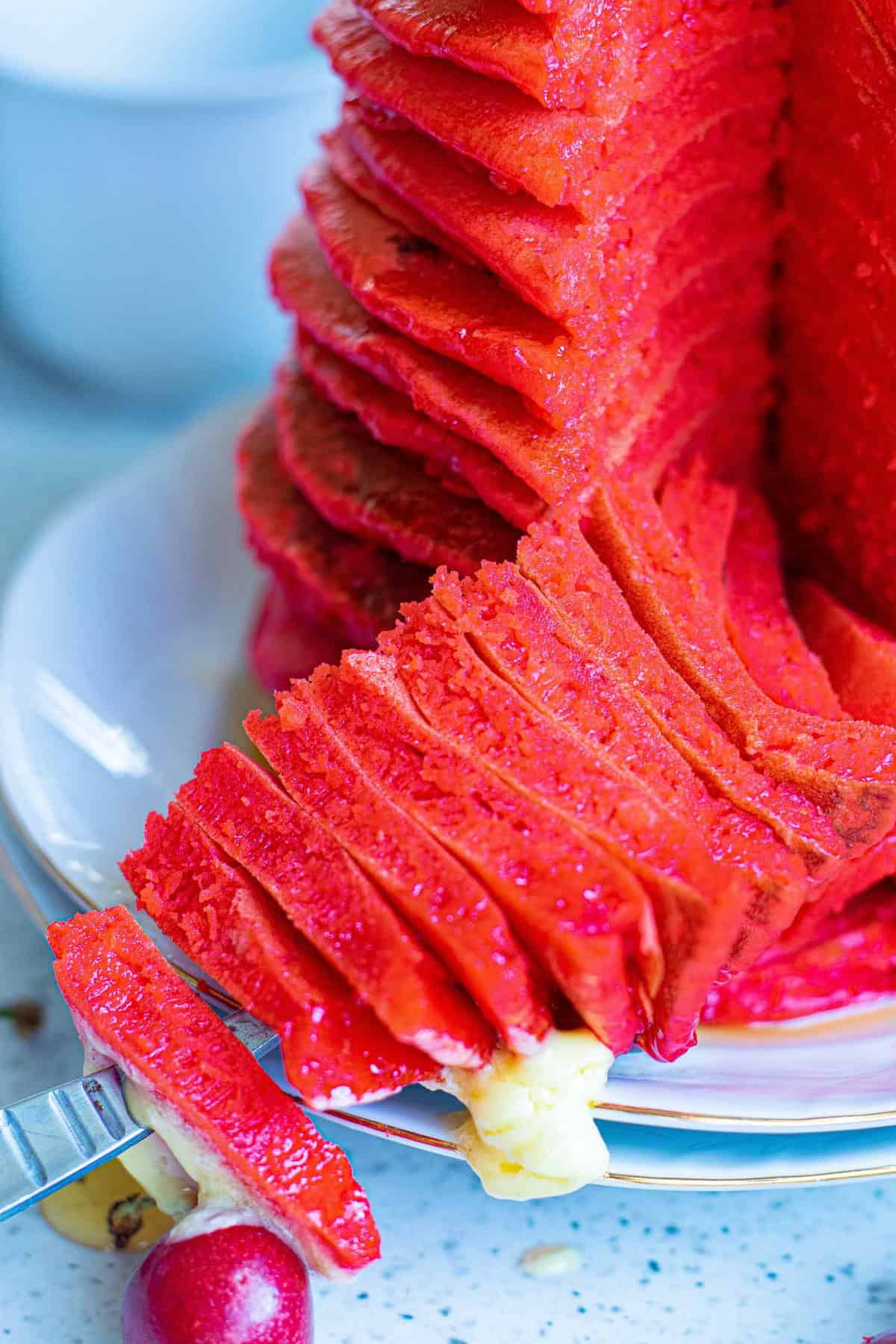 Close up of fluffy red pancakes.