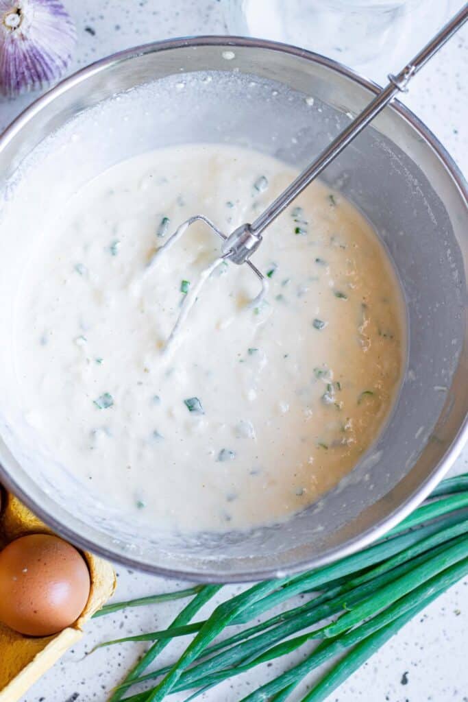 Pancake batter with green onions.