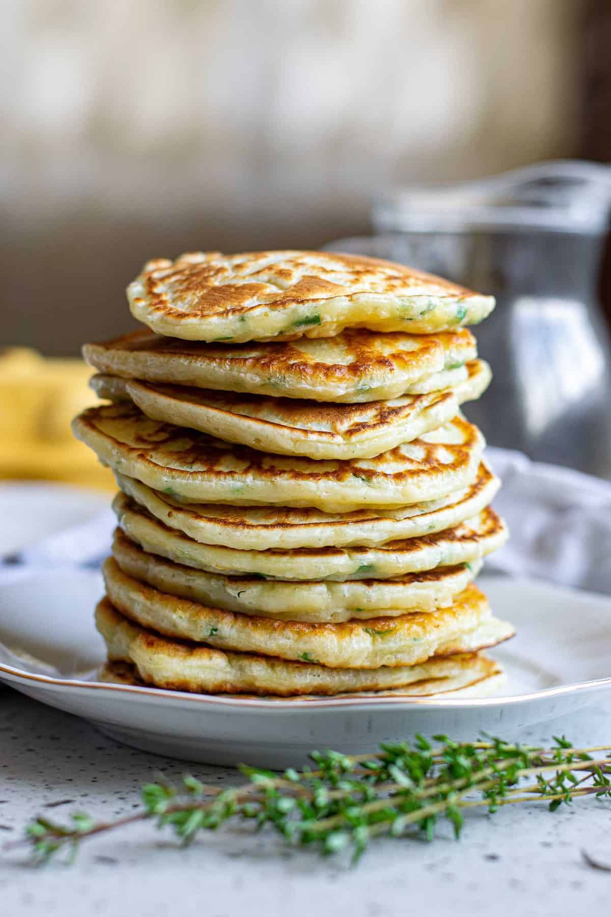 Savory pancakes stacked up with no toppings.