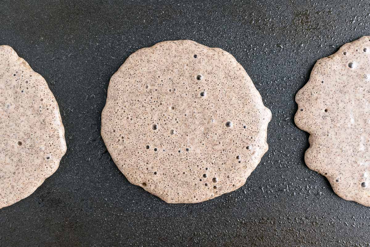 Bubbles forming on pancakes.