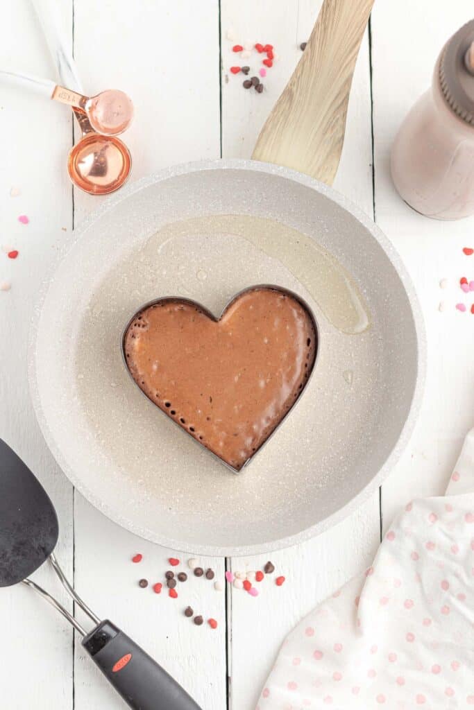 Pancake batter in a heart cookie cutter
