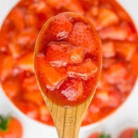 Close of strawberry sauce on a spoon.