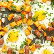Close up of eggs, sausage, and sweet potatoes.