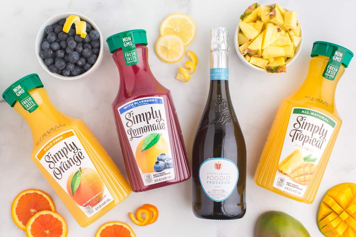 Ingredients needed for mimosa bar, including various juices.
