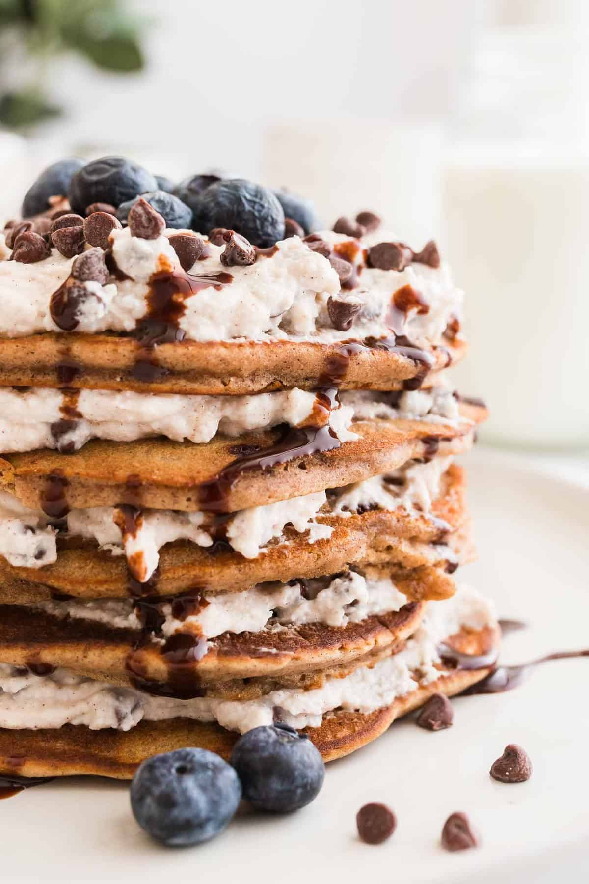 Stack of cannoli pancakes layered with ricotta filling.