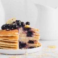 Lemon blueberry pancakes, with a cut out to show texture.