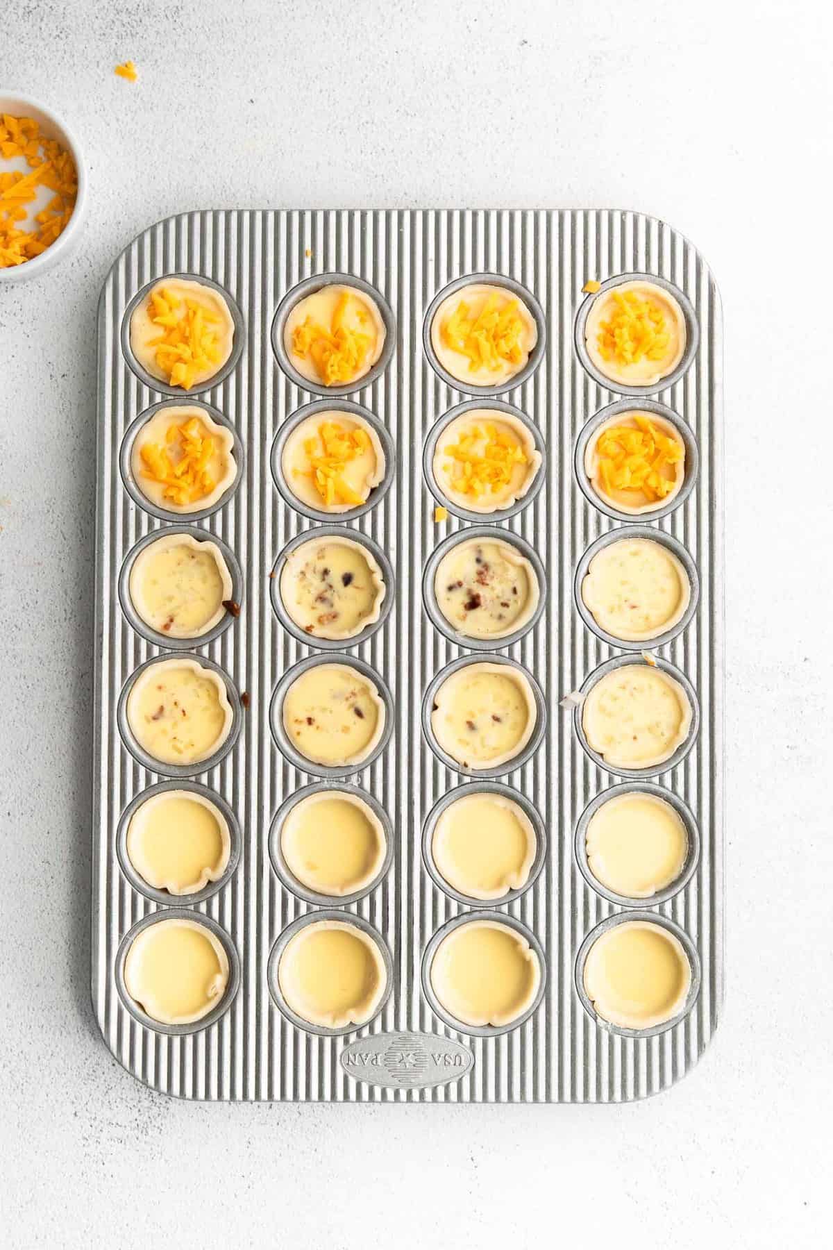 Unbaked mini quiches.