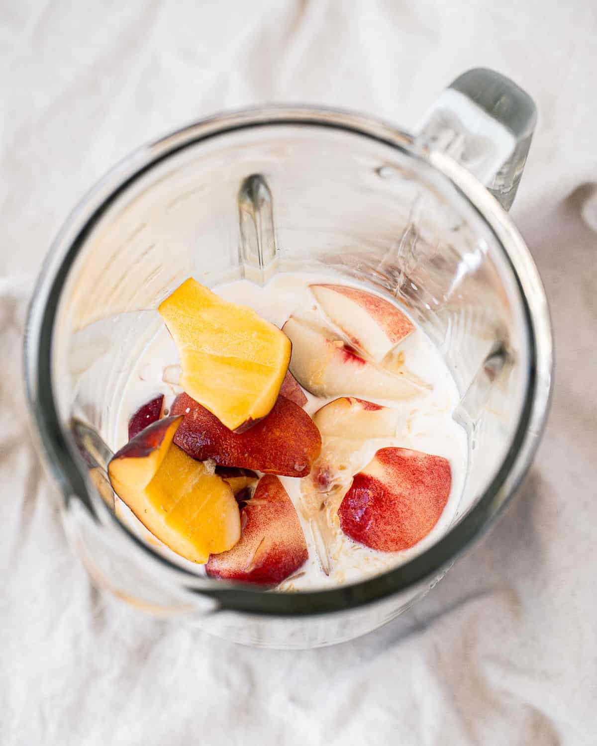 Unblended smoothie, nectarines are visible.