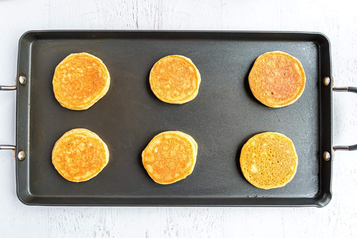 Paleo pancakes on a griddle.