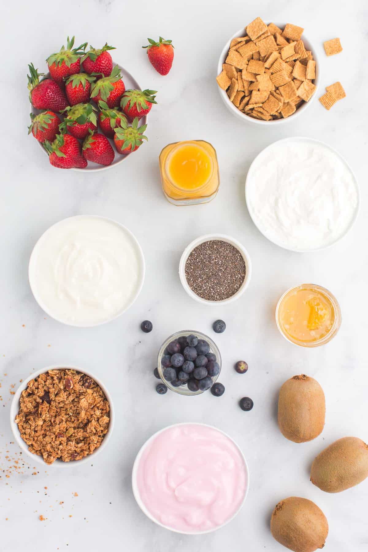 Assortment of ingredients needed, including three types of yogurt.