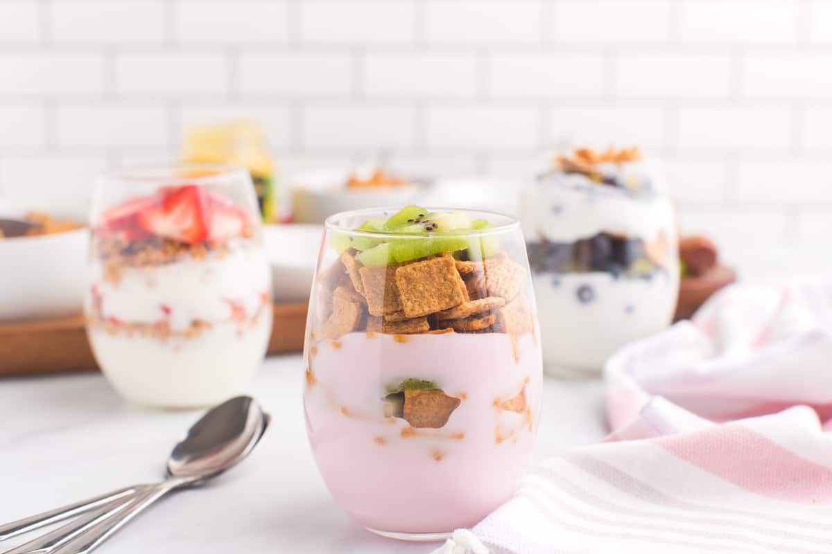 Strawberry yogurt parfait with golden grahams.