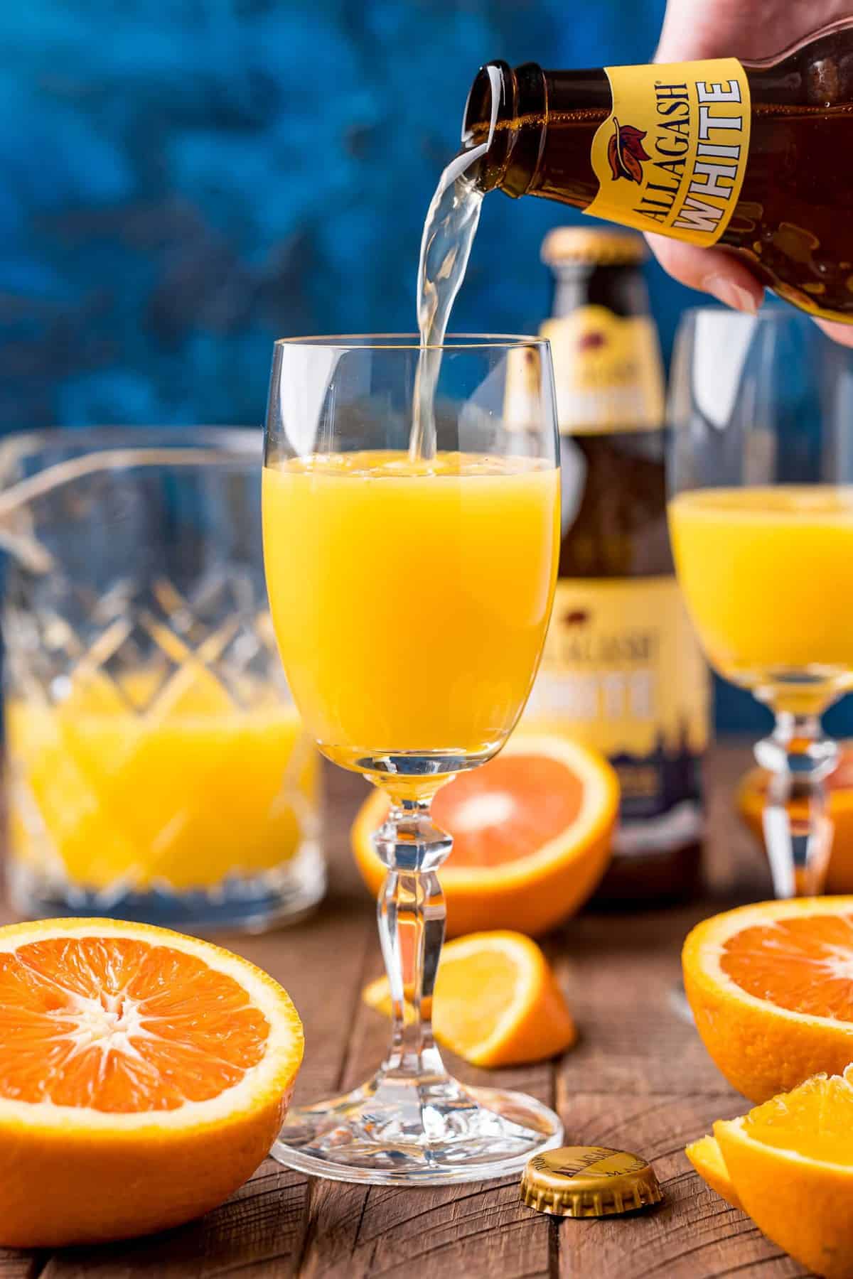 Beer being poured into orange juice.