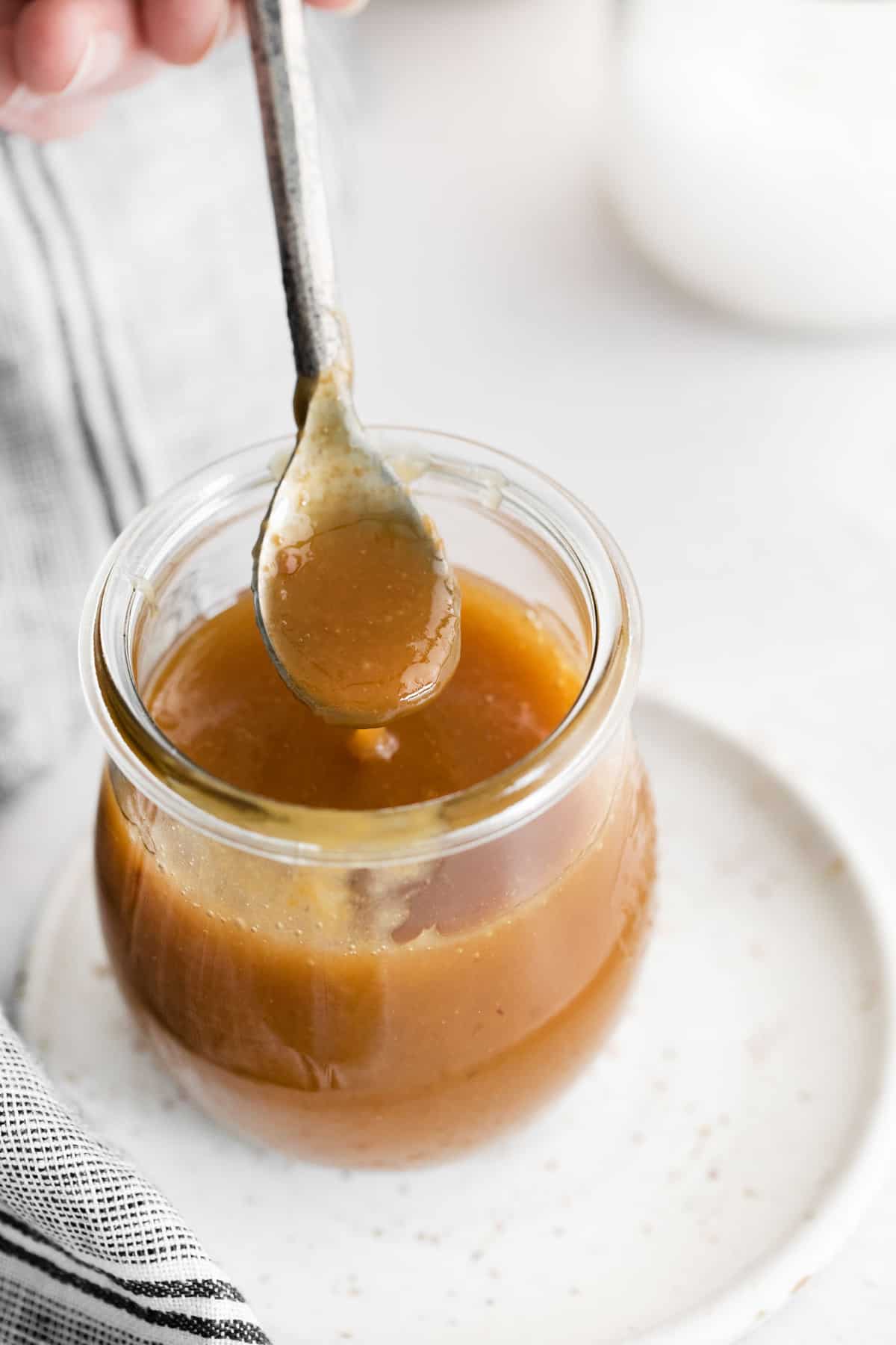 Caramel on a spoon to show texture.