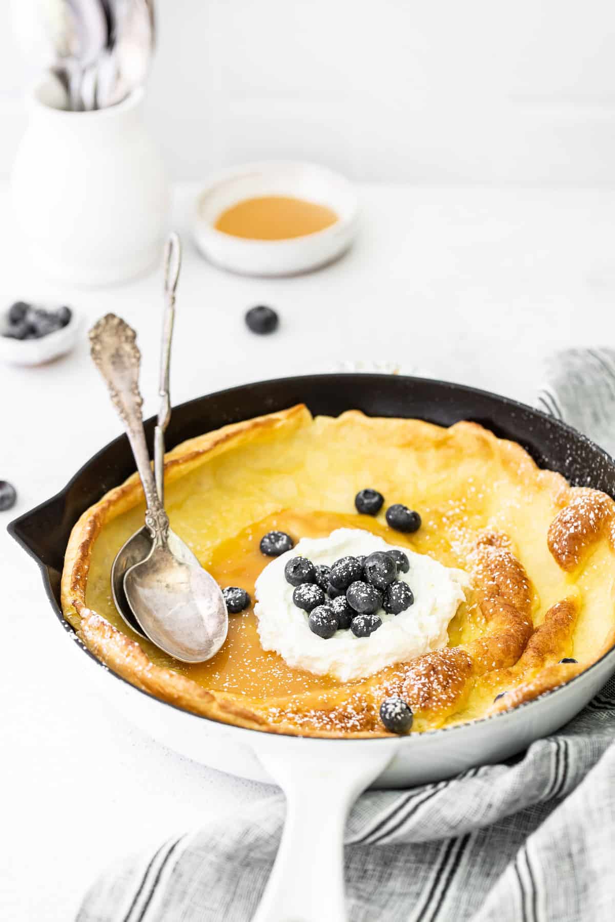 German pancake topped with blueberries.