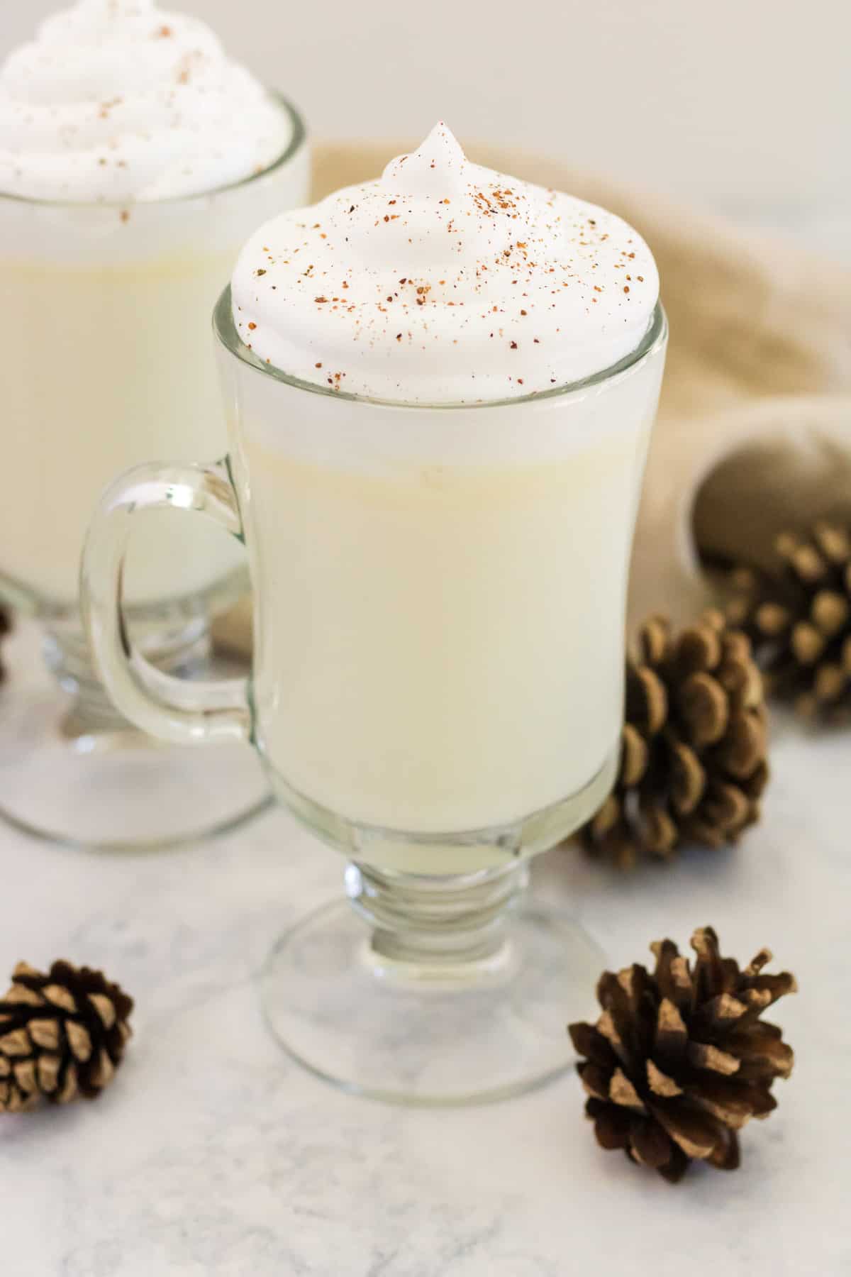 White hot chocolate styled with pine cones.