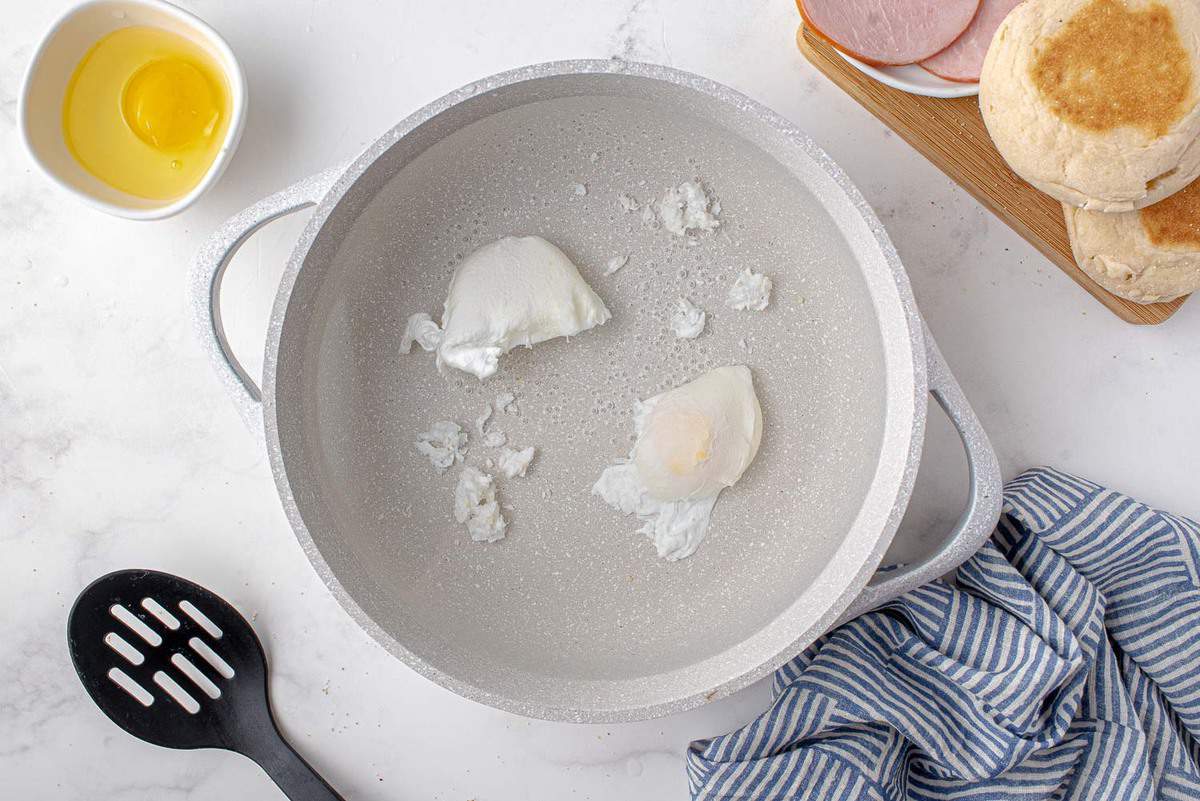 Poached eggs in a pan.