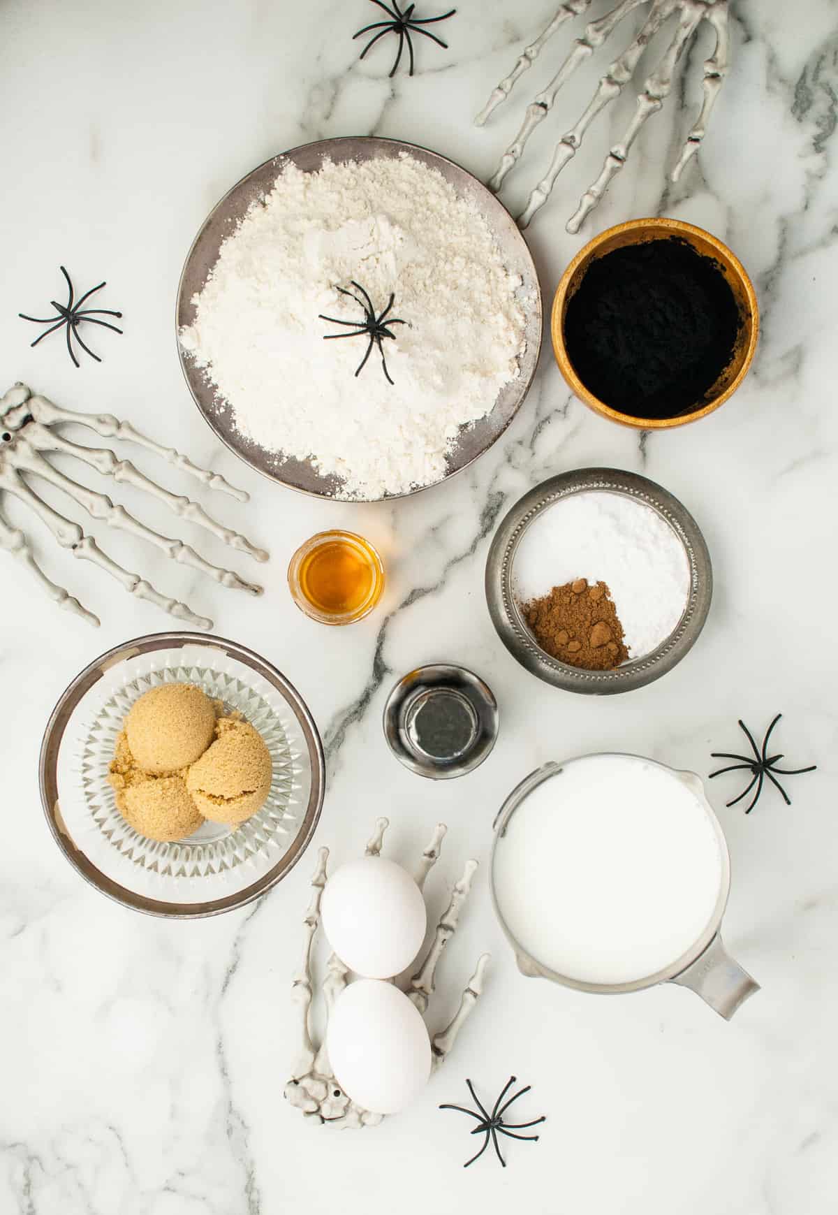 Overhead view of ingredients needed for recipe, on a marble background.