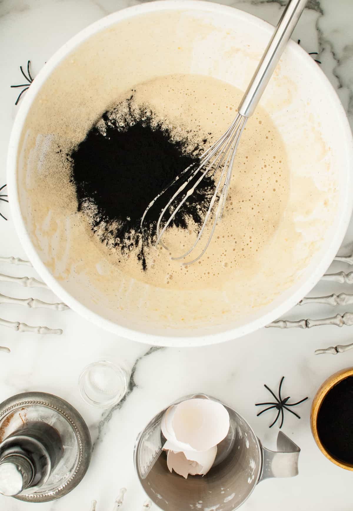 Pancake batter with activated charcoal on top.