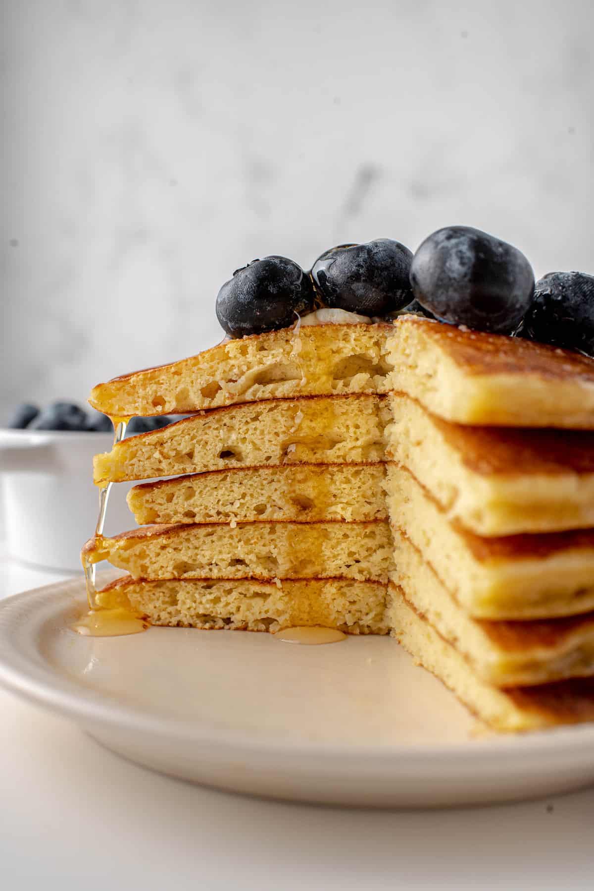 Stack of low carb pancakes cut to show texture.