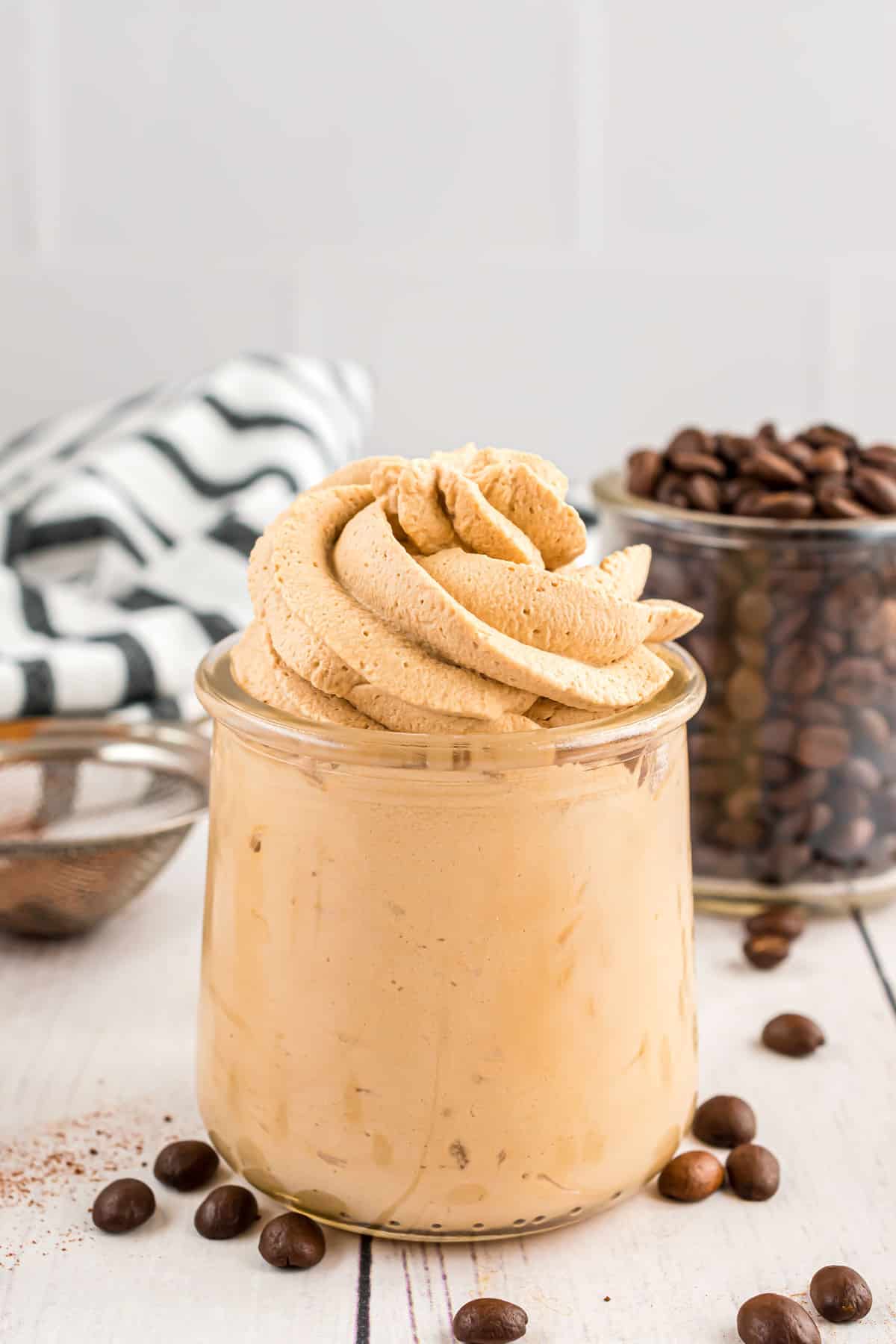 Coffee whipped cream in a small glass jar.