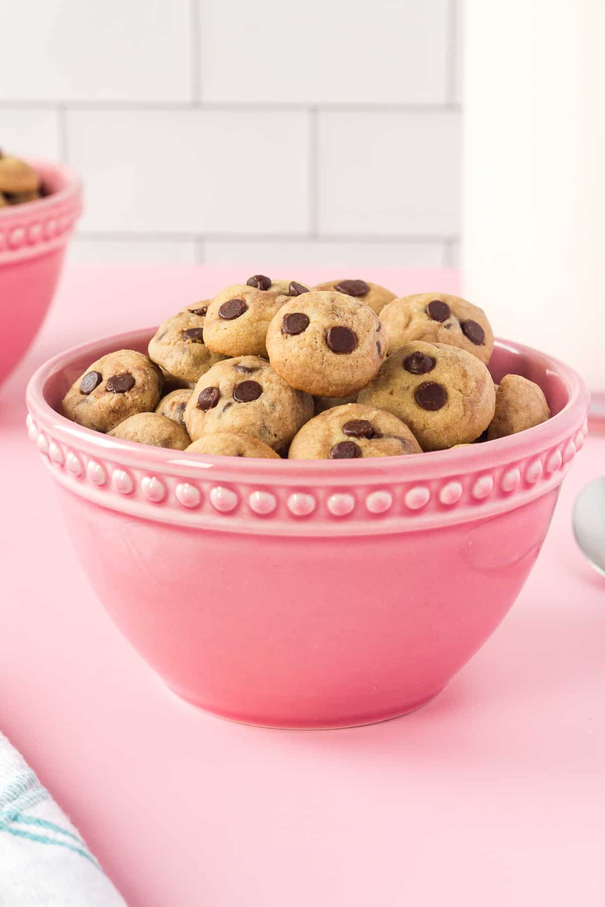 Cookie cereal in a bright pink bowl on pink background.