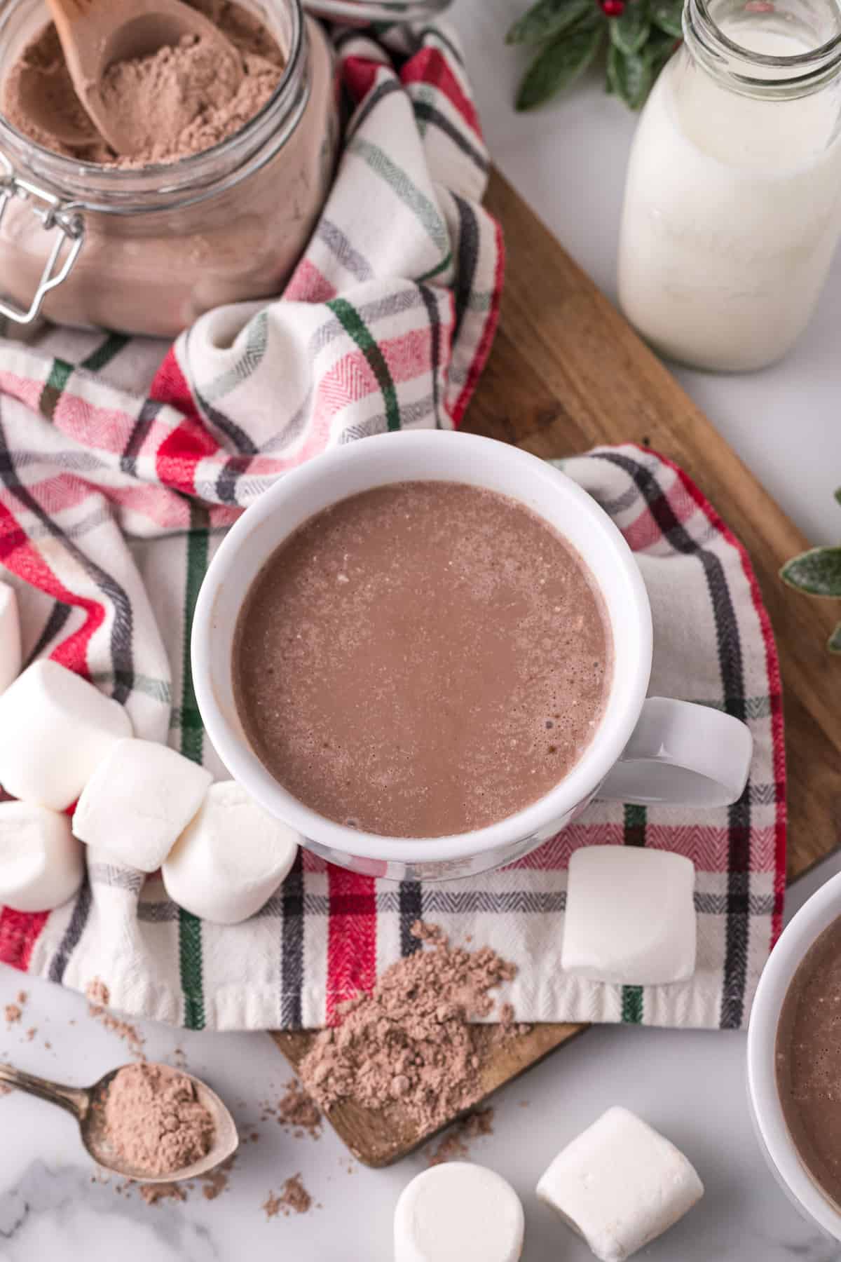 Overhead view of hot chocolate in a white mug.