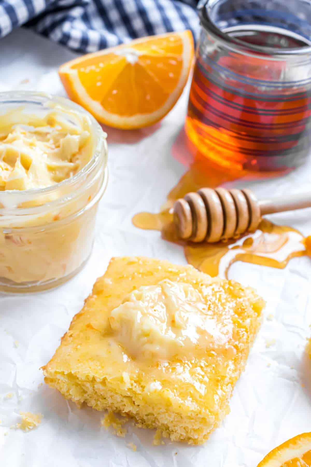 Orange honey butter on cornbread, more in background.