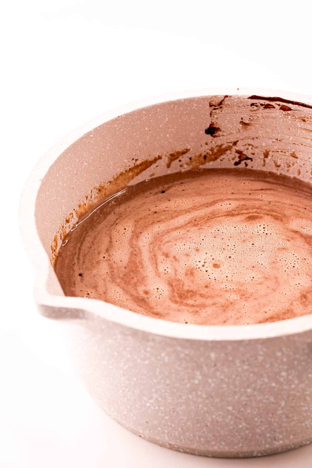 Hot chocolate in saucepan.