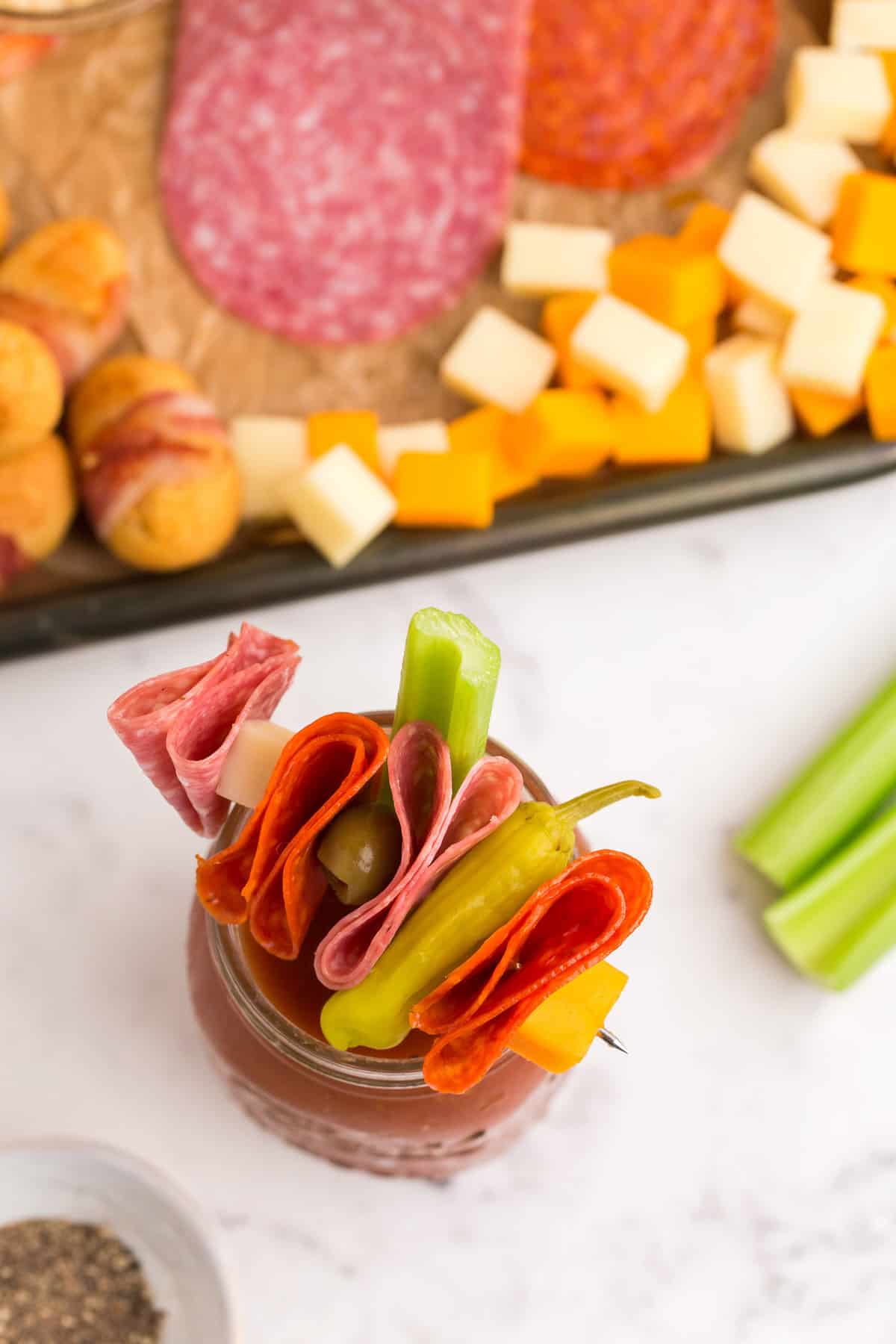 Bloody Mary topped with deli meats, pepperoncini. 