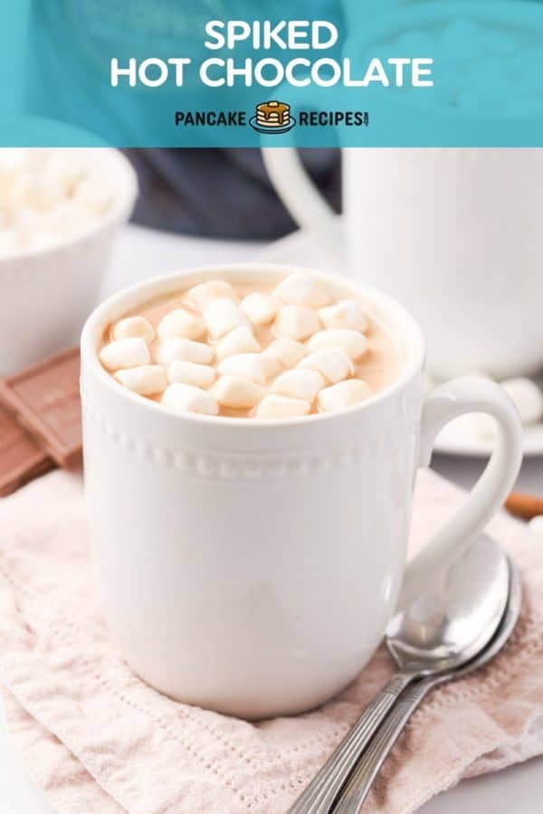 Cocoa in a white mug, text overlay reads "spiked hot chocolate."