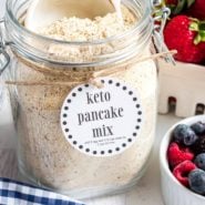 Keto pancake mix in a jar with a label. A scoop is in it.