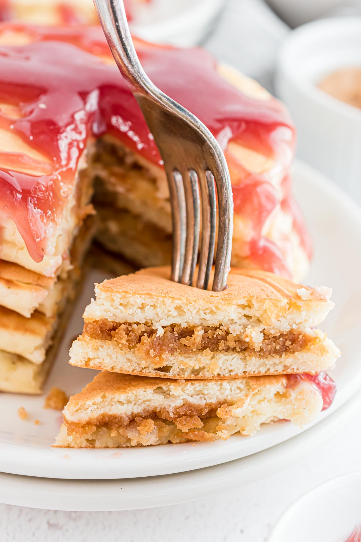 Peanut butter stuffed pancakes on a fork.