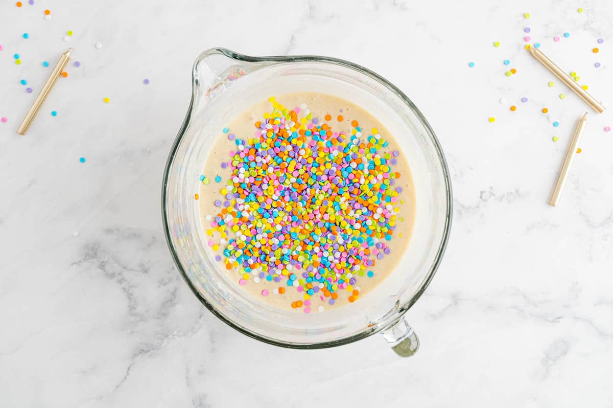 Sprinkles on top of pancake batter.