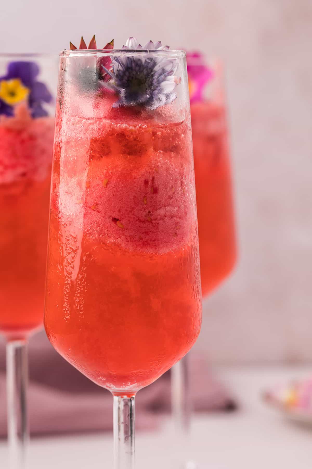 Close up of flowers on top of a champagne float.