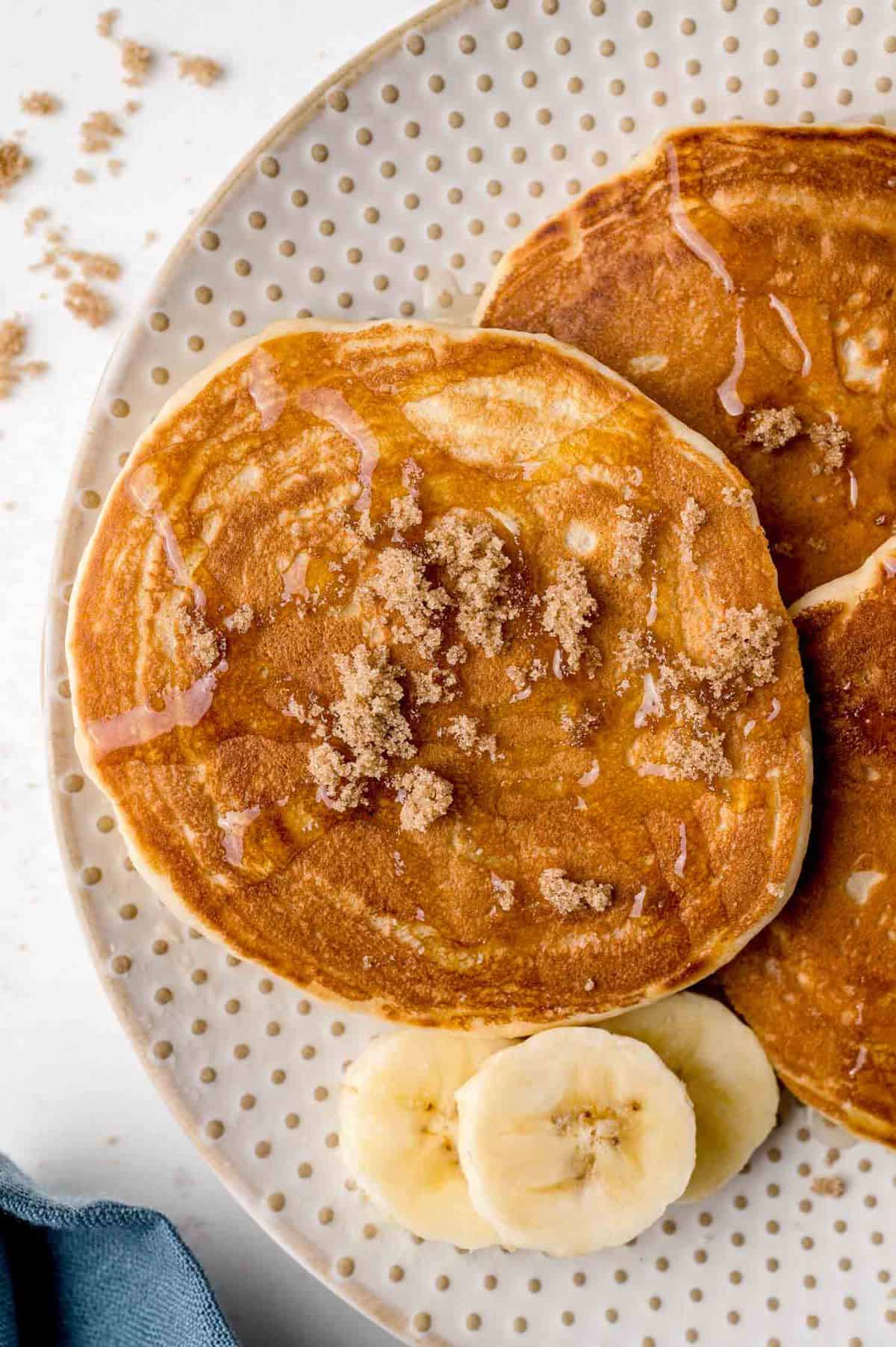 Pancake sprinkled with brown sugar.