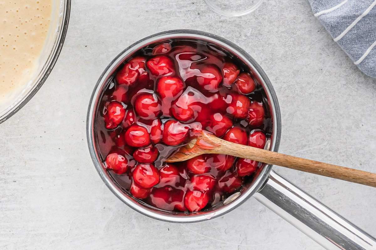Cherry pie filling in a small saucepan.