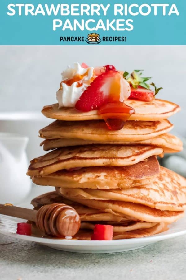 Tall stack of pancakes, text overlay reads "strawberry ricotta pancakes."