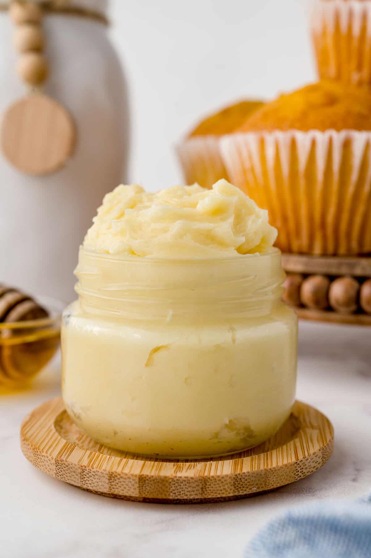 Honey butter in a small glass jar.