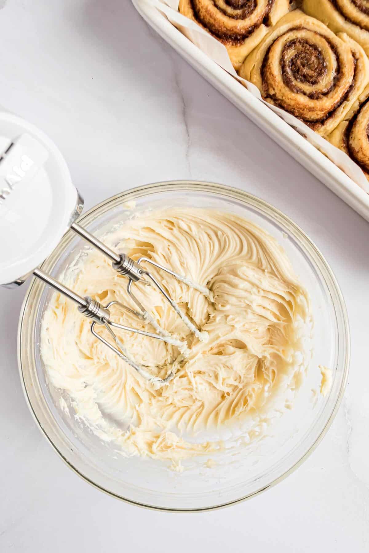 Cream cheese icing in a mixing bowl.