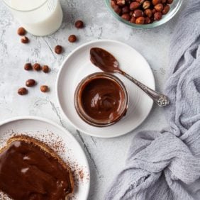 Homemade nutella spread in a jar and on toast.