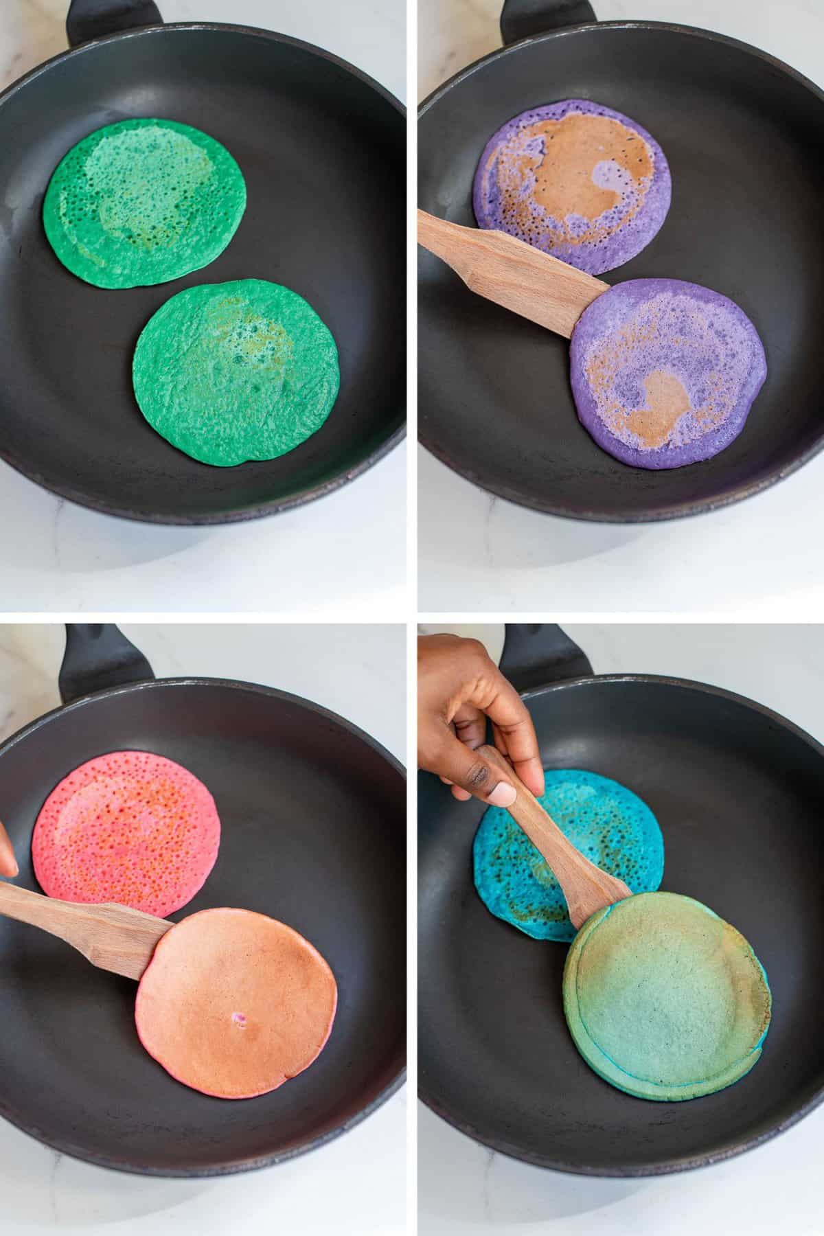 Colorful pancakes being made in a black skillet.