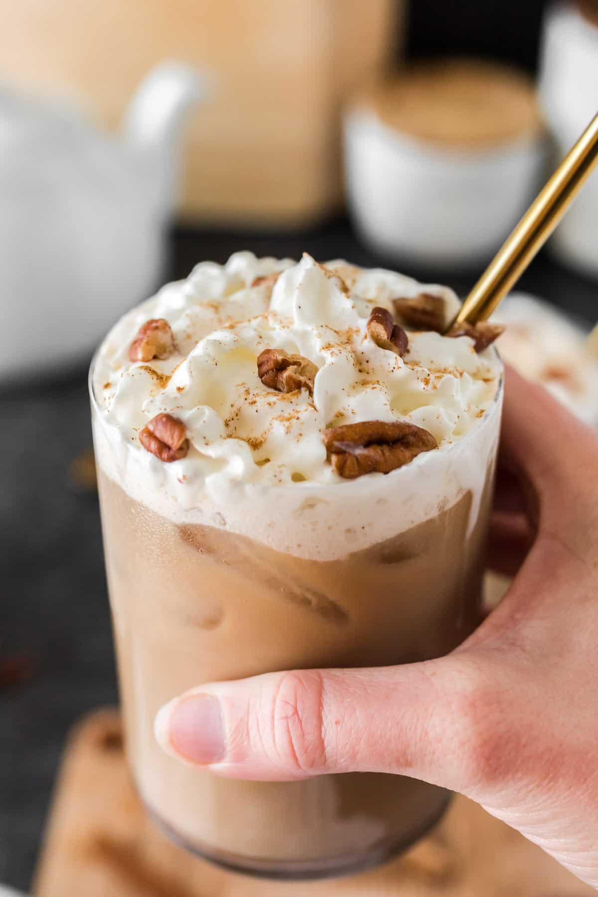 Iced latte garnished with pecans.