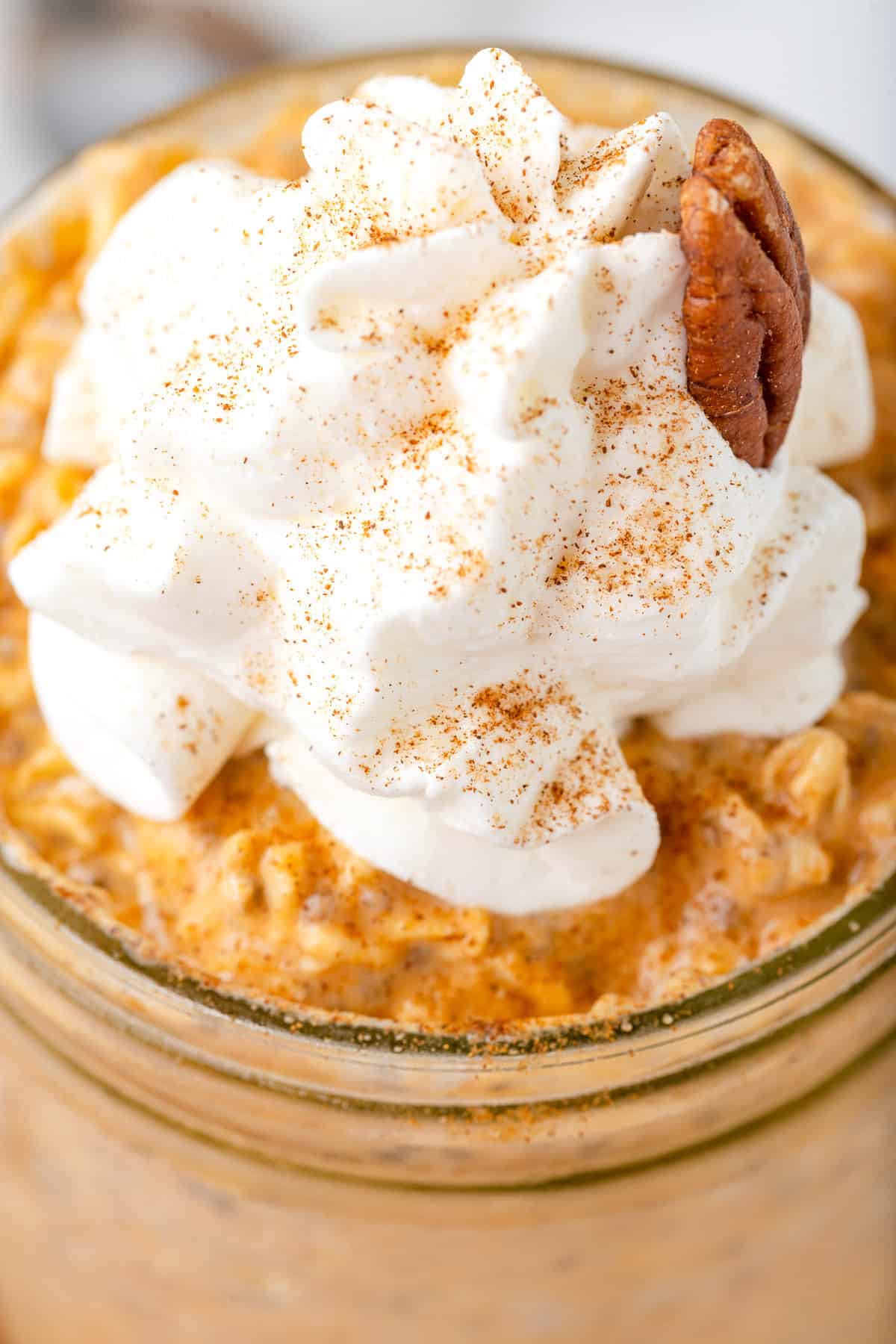 Overnight oats topped with whipped cream.